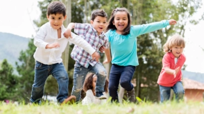 Children running in a field