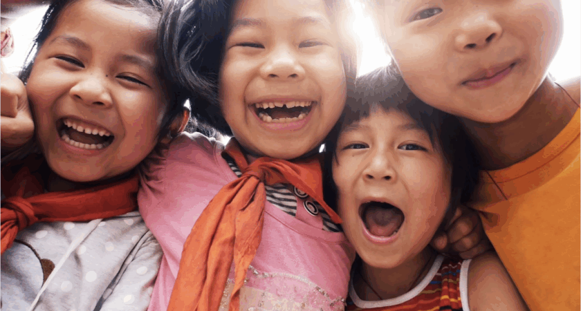 Group of kids wearing red and orange, ready for family fun in October