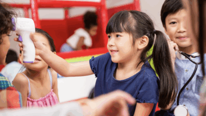 Children pretending to be doctors, a common fantasy play scene