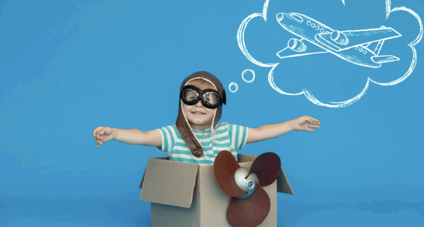 Boy pretending to be a pilot, representing fantasy play